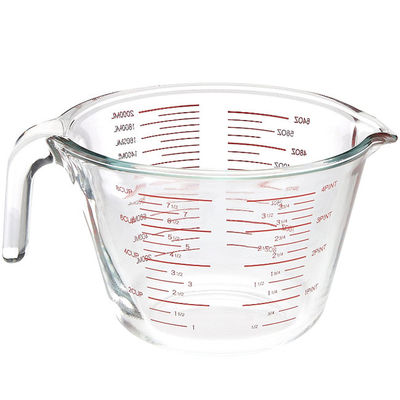 Het Glas die van het keukenbaksel Kop met Rode Grafiekmicrogolf en Oven meten